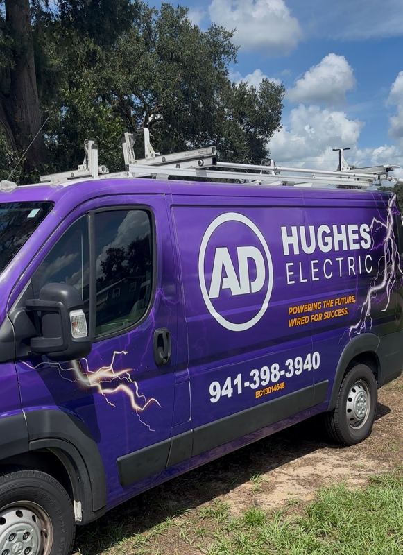 Purple Ram ProMaster van wrapped for an electrical company