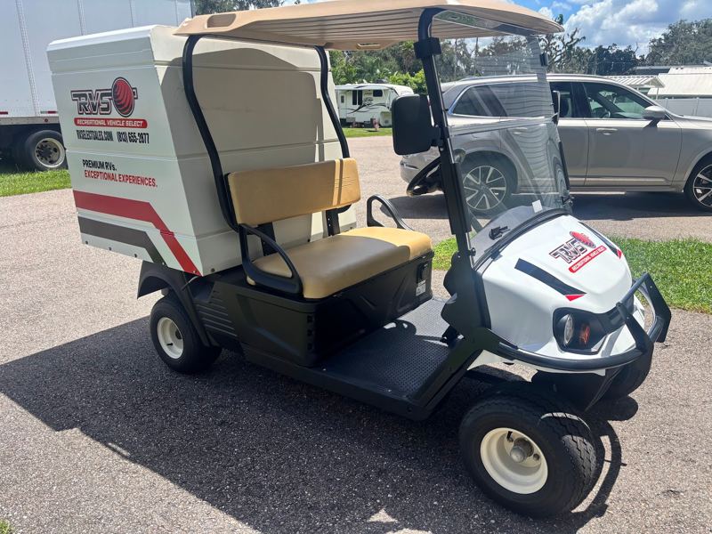 White utility cart with red and black brand graphics on the cargo box